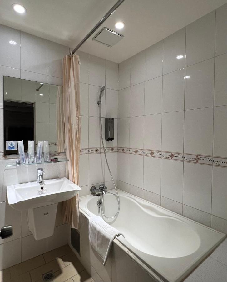 Dlinn Hotel Тайджун Екстериор снимка